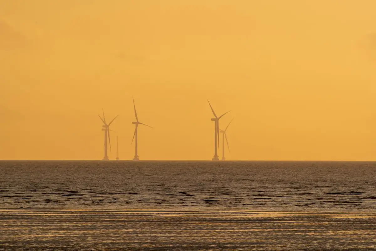 Offshore wind turbine monopile with subsea rock bag scour armor at the seabed, North Atlantic